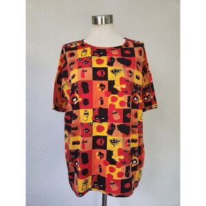 LuLaRoe Irma Tee Size XS Womens‎ Disney Incredibles Multicolor Print Blouse Top